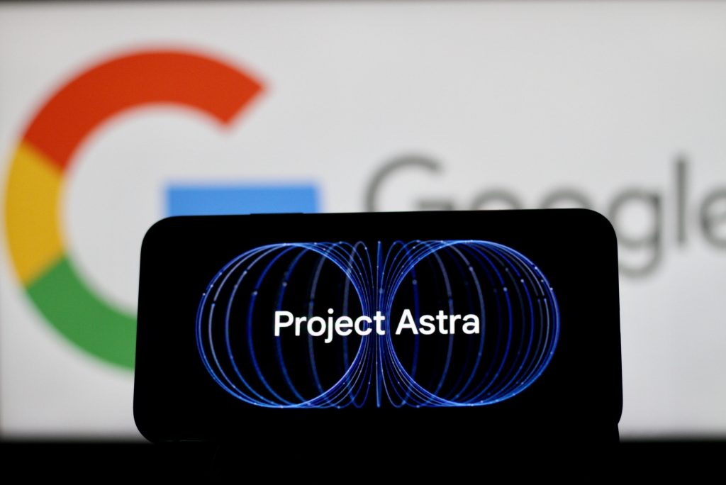 Google's Project Astra logo on a phone screen, in front of the Google logo.