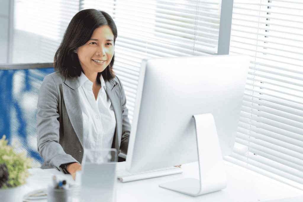 Business lady working at a computer in an office
