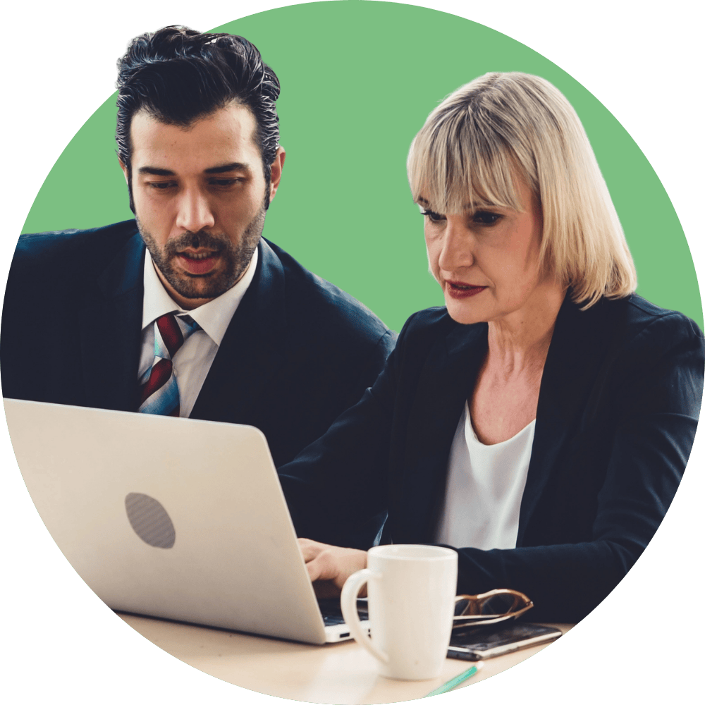 Business man and women working on a laptop together
