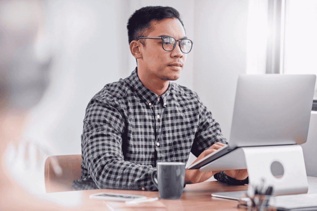 Business man working on a laptop in an office