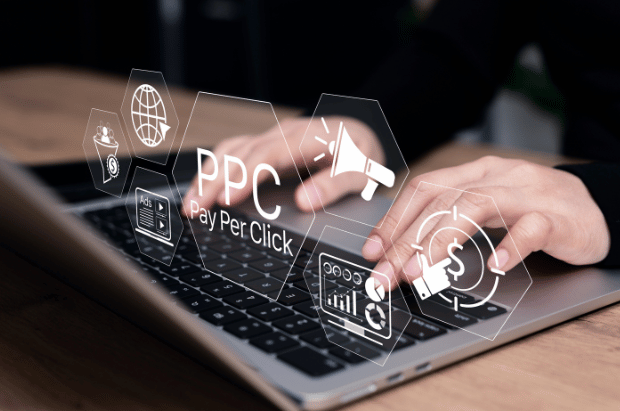 hands on a laptop with icons like 'ppc'